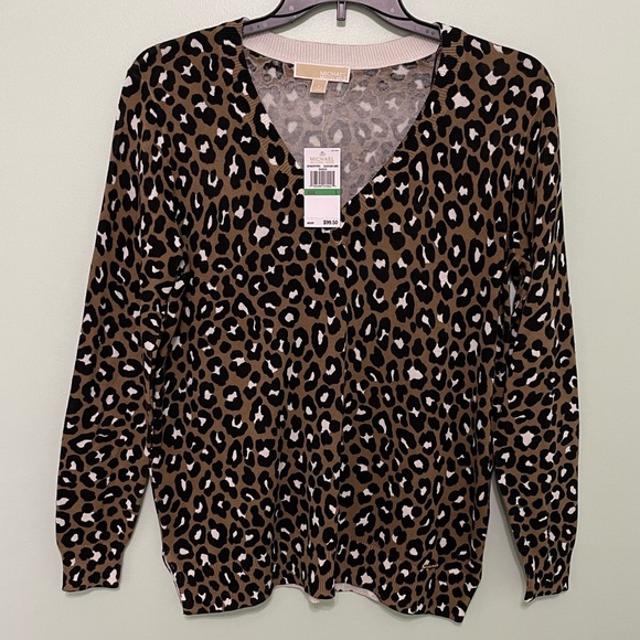 MICHAEL Michael Kors Tops - Brand new Michael Kors animal print sweater size L 2 inch slit up each side